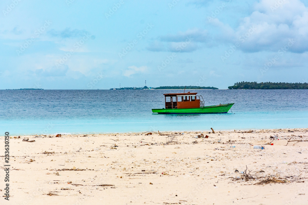 Stunning tropical beach with white sand in the Maldives. a great place to dive into meditation and Nirvana Stunning tropical beach with white sand in the Maldives. a great place to dive into meditation and Nirvana