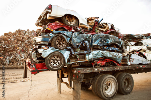 Φωτογραφία Stack of crushed cars on trailer at junkyard
