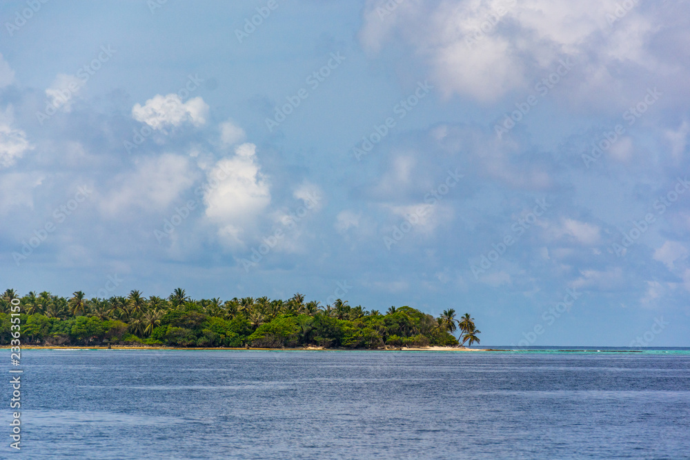 Stunning tropical beach with white sand in the Maldives. a great place to dive into meditation and Nirvana Stunning tropical beach with white sand in the Maldives. a great place to dive into meditation and Nirvana