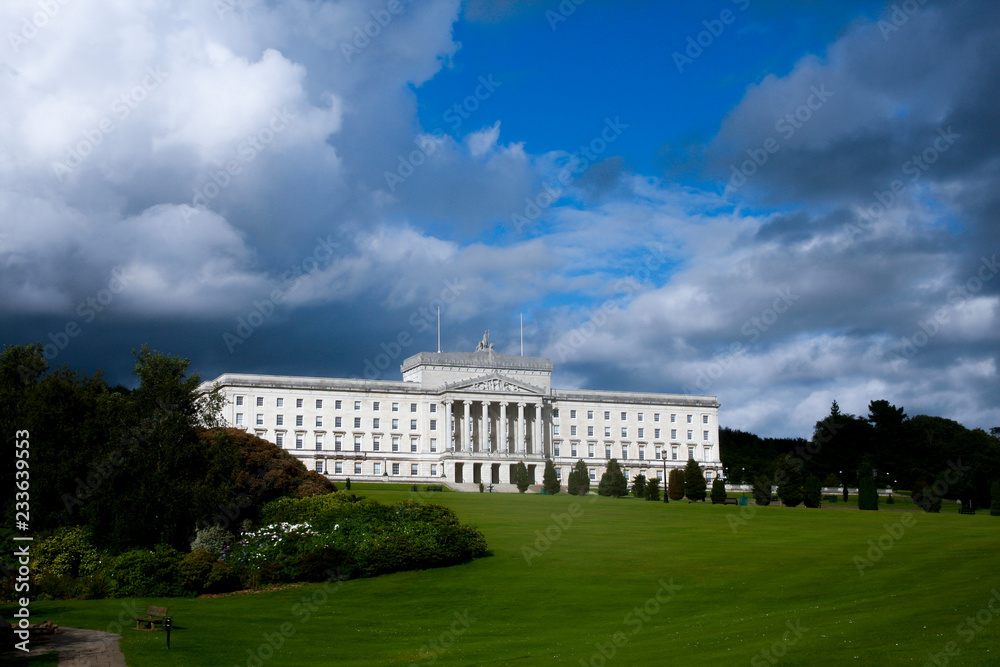 Obraz premium Dark storm clouds gathering over Northern Ireland Executive - Parliament Buildings, Stormont, Belfast
