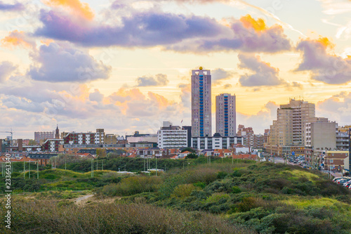 Schilderij op canvas View on the city with skyscrapers from the dunes of Scheveningen a touristic and