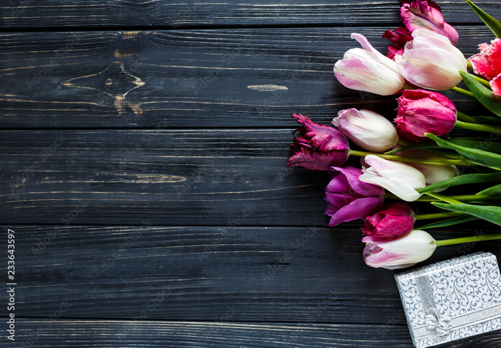 colorful tulips, wite  box  on the gray wooden table. Valentines, spring background. floral mock up.  with copyspace