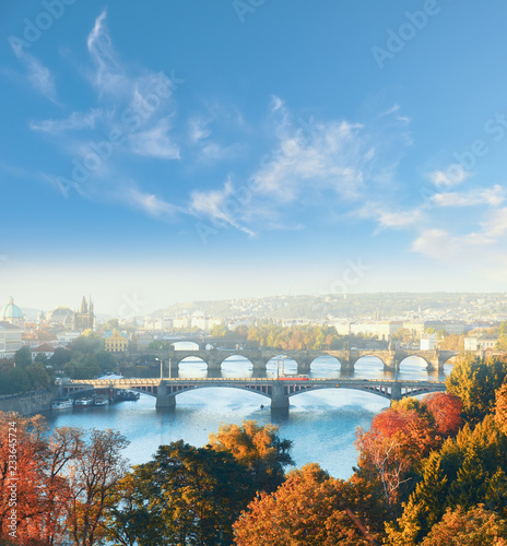 Central Prague and six bridges on Vltava river in Prague, Czech Republic, on a misty morning in Fall