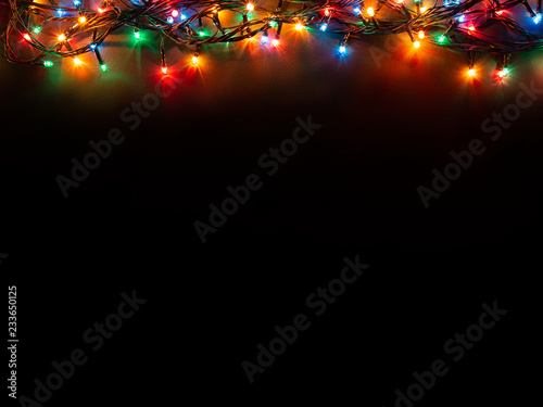 Christmas background with lights and free text space. Christmas lights  border. Glowing colorful Christmas lights on black background. New Year.  Christmas. Decor. Garland. Stock Photo | Adobe Stock