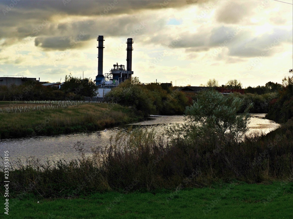 View over the River Aire to the Ferrybridge Power Station from Fairburn Ings Nature Reserve, Yorkshire, England