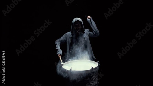 emotional drummer on a black background photo