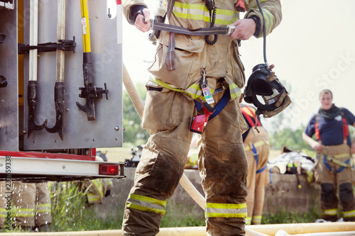 Schilderij op canvas Firefighters wearing protective clothing