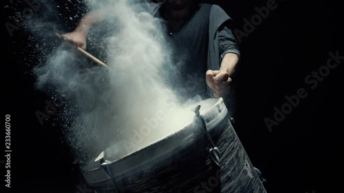 Slow motion dummer. game on a dusty drum close up photo