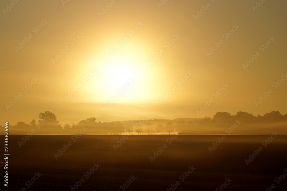 sunset over field sunset over field