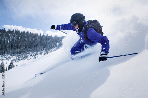 Skier  on snow covered mountain against sky