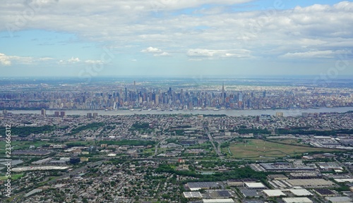Aerial view of the Manhattan skyline in New York City seen from an airplane window in New Jersey