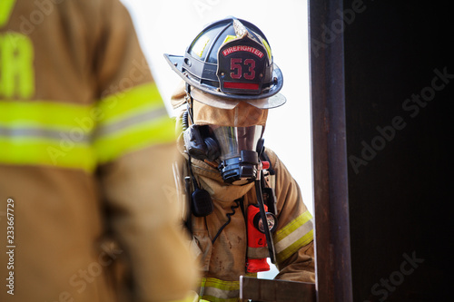 Close-up of firefighters with gasmask