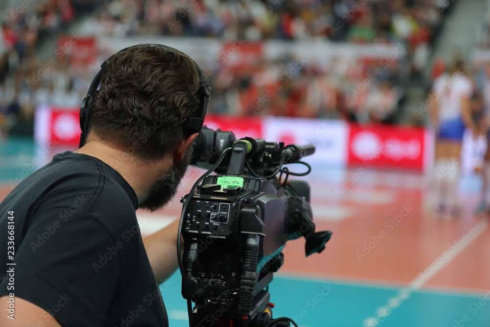 professional cameraman filming sport