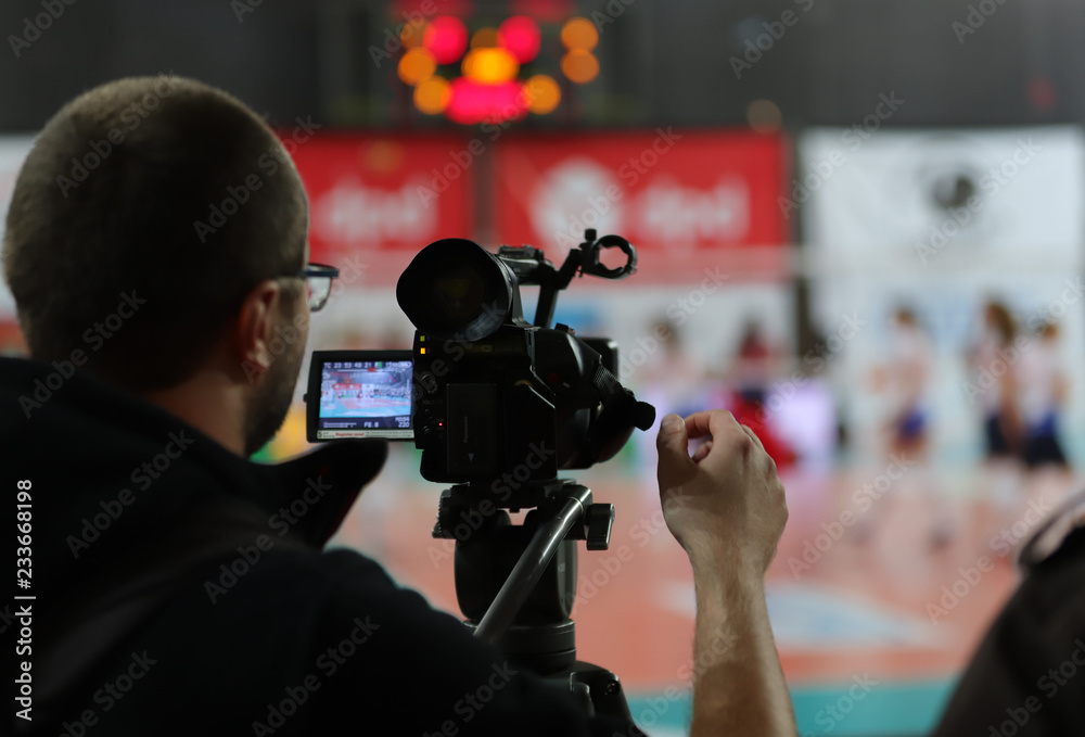 professional cameraman filming sport, Poland