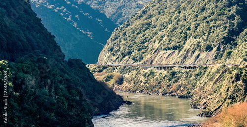 Landscape image of the Manawatu Gorge taken on it's last operational day. The gorge was closed permanently after landslides made it unsafe for travel.