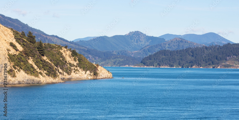 Landscape image of the sea and land that makes up the breath taking scenery of the Marlborough Sounds in New Zealand.