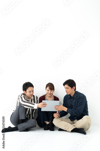young asian group relaxing on white background