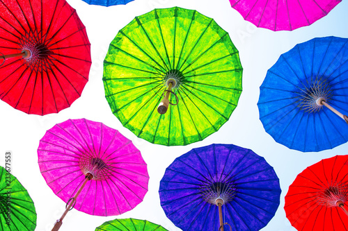 Floating umbrella in the air background. Colorful paper umbrella floating.
