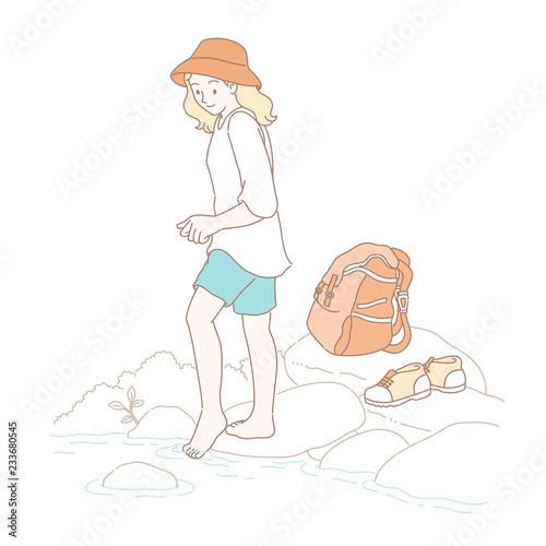 Girl playing water by the river