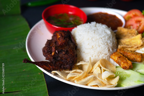 nasi lemak kukus with quail meat top view, malaysian local food