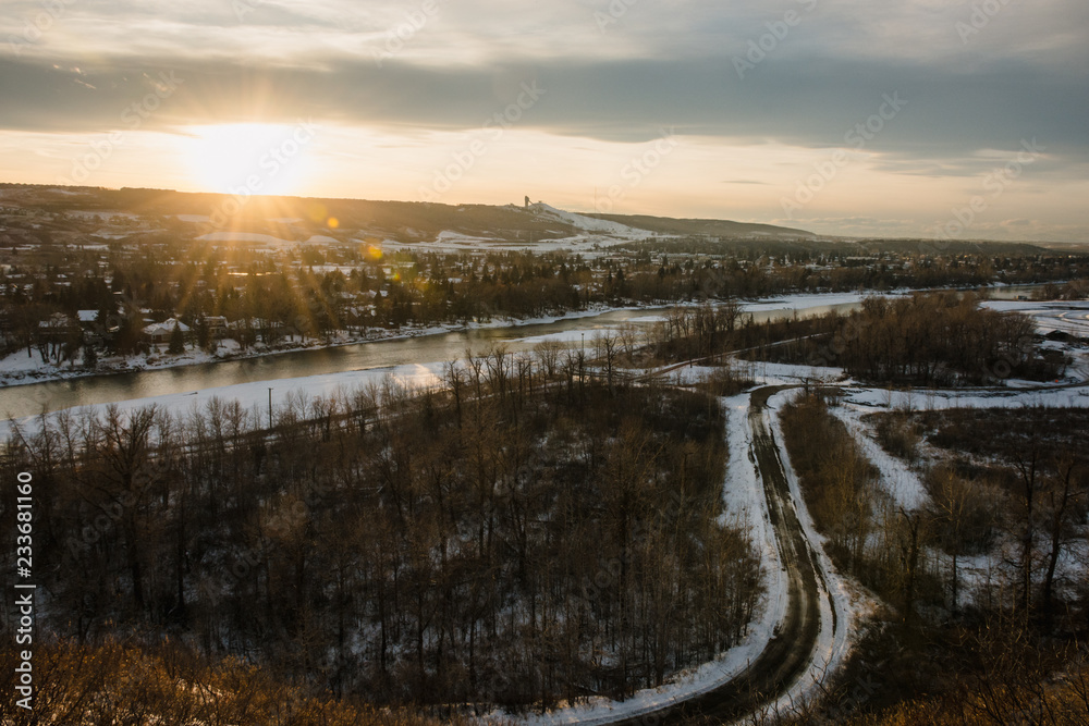 The sun setting over the horizon on a snowy evening in Calgary
