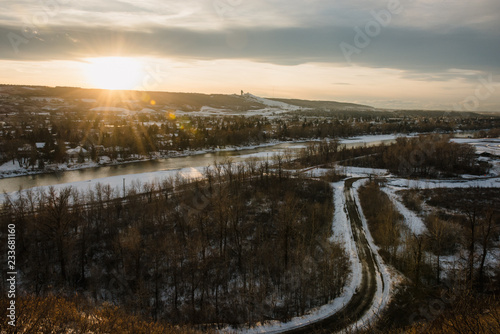The sun setting over the horizon on a snowy evening in Calgary © josev82