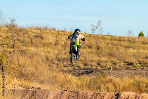 Biker on a motocross bike on the track