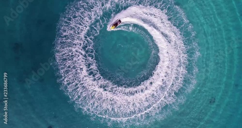 Jet skiing in circles in the Indian ocean. Powerful jet ski. Medium shot photo