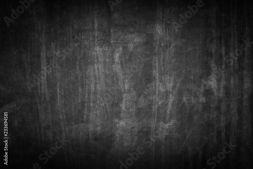 black background. Grunge texture. Dark wallpaper. Blackboard. Chalkboard