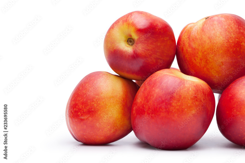 group of juicy peaches lying isolated on a white background group of juicy peaches lying isolated on a white background
