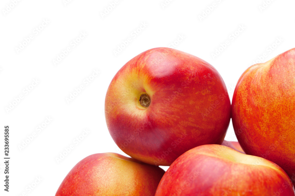 group of juicy peaches lying isolated on a white background