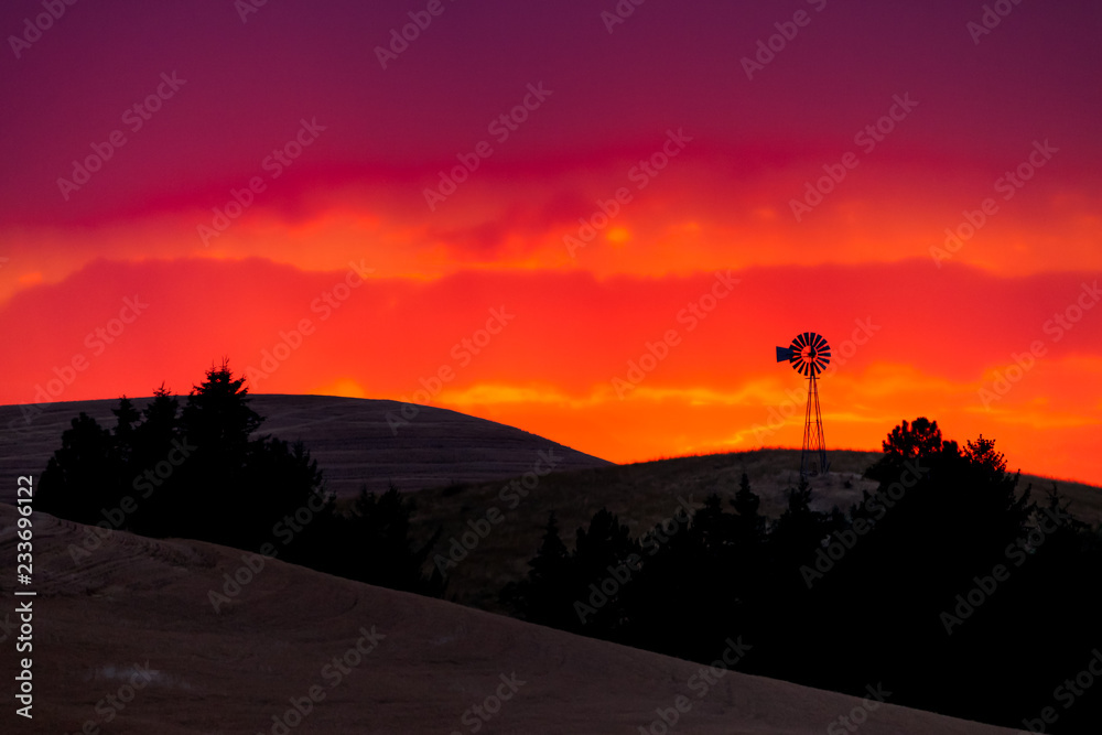 Old windmill in the Palouse of eastern Oregon, USA at sunset