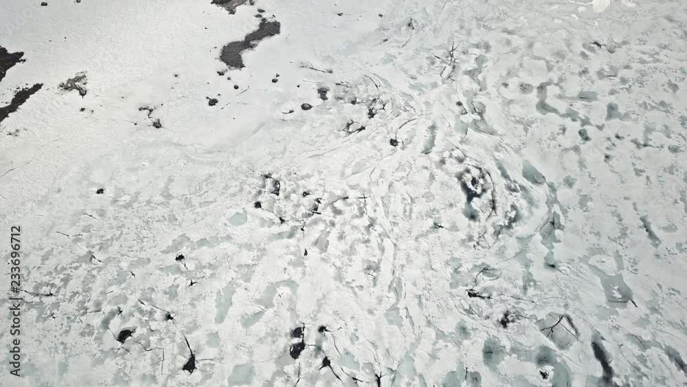 Cracking patterns of melting mountain lake in Norway Cracking patterns of melting mountain lake in Norway