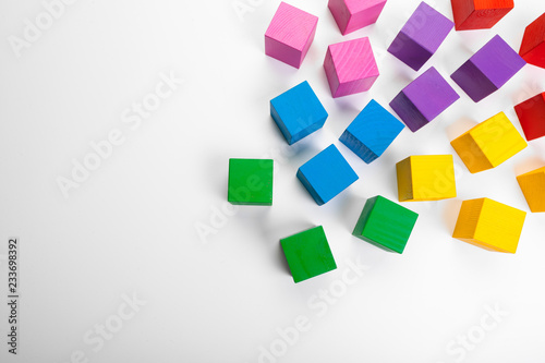 Colorful wooden building blocks isolated on white background