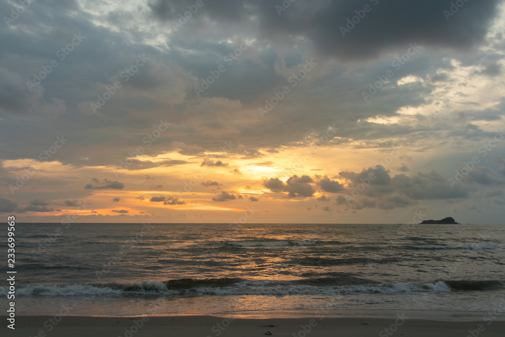 Golden sunset cloudy sky on calm and clean the beach. Golden sunset cloudy sky on calm and clean the beach.