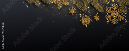 Black festive banner with fir branches and golden shiny snowflakes. photo