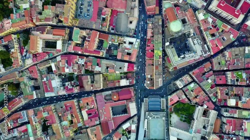 Aerial, rising, screewdriver, drone shot, above cars and houses, in the city of Napoli, on a sunny, summer day, in Naples, Italy photo