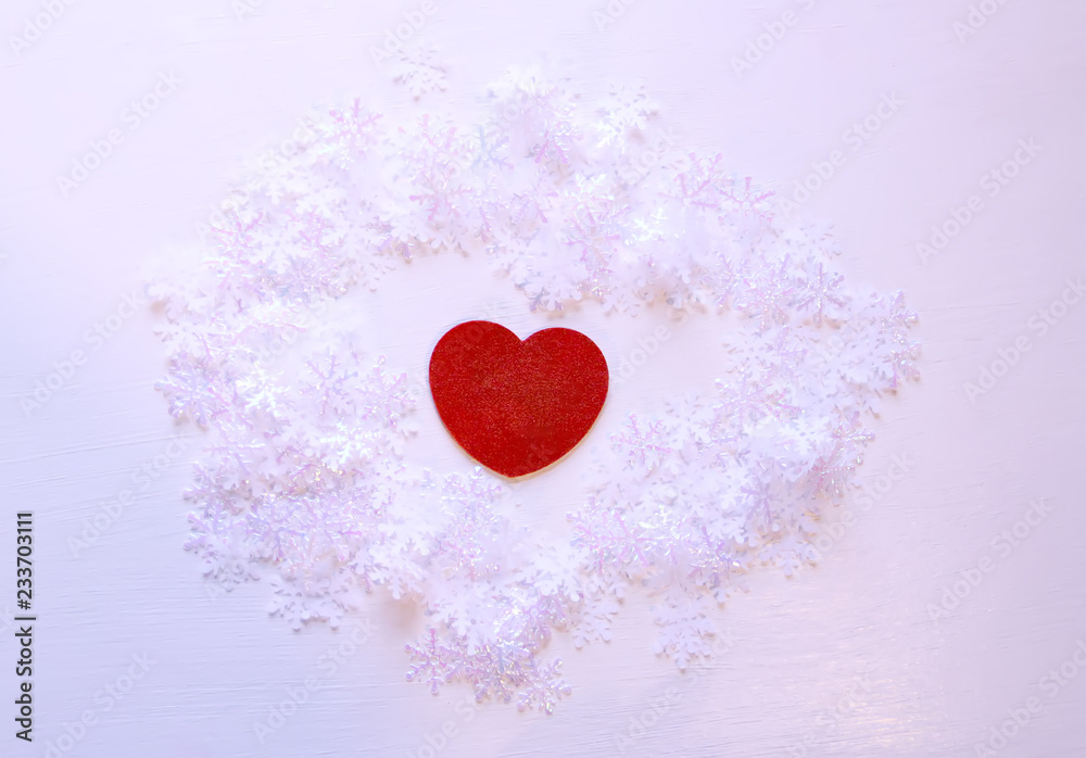 Artificial snowflakes and red decorative hearts