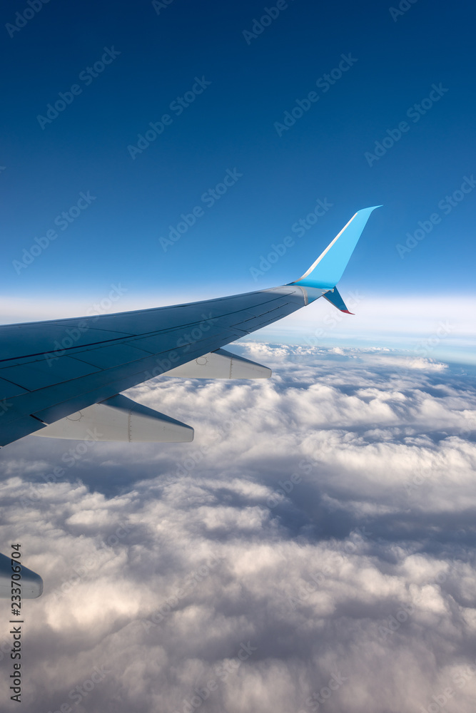 Commercial Airplane - Flying above the Clouds