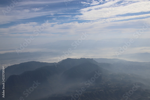 Clear Blue Sky with the Scenery of the Mountain in the Mist