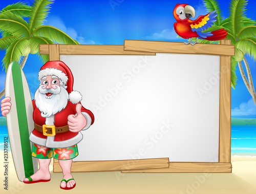 Santa Claus Christmas cartoon character in shorts and flip flops holding his surfboard on a tropical beach with palm trees and parrot sign background.