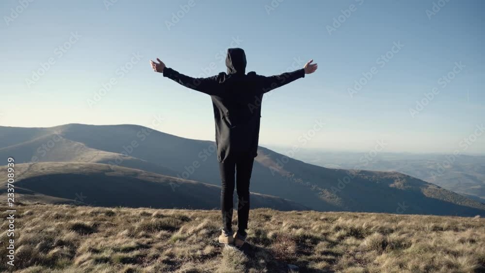 Man on mountain top looks down determined to conquer the world . Male head silhouette back side view at evening sky background enjoying view of success. Self-made person concept. Man on mountain top looks down determined to conquer the world . Male head silhouette back side view at evening sky background enjoying view of success. Self-made person concept.