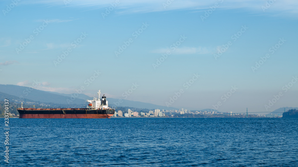 Downtown Vancouver with tanker ships in the foreground.