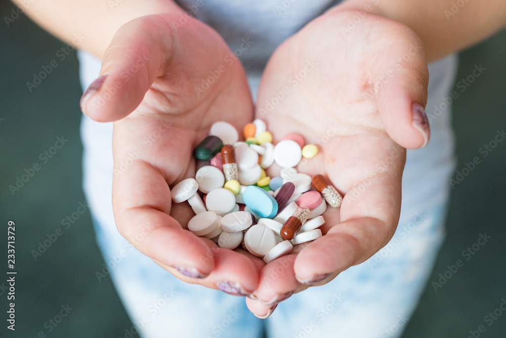 pills capsules in woman hands. pharmacy dosage and drug administration. pills capsules in woman hands. pharmacy dosage and drug administration.