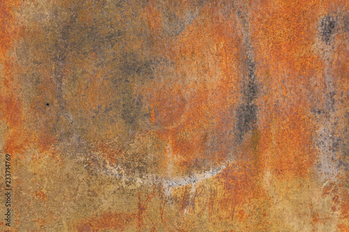 Old painted metal surface. Rusty metal, peeling paint, red and yellow tones. Worn metallic iron panel.