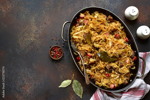 Bigos - cabbage stewed with meat, dried mushrooms and sausage.Traditional dish of polish cuisine.Top view with copy space. photo