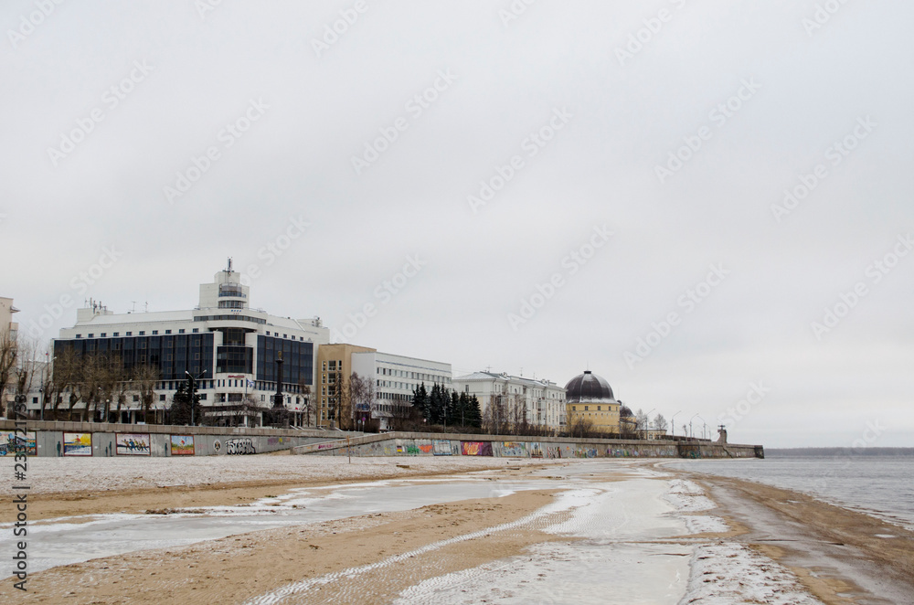 View of Arkhangelsk covered with the first snow from a city beach in November Russia