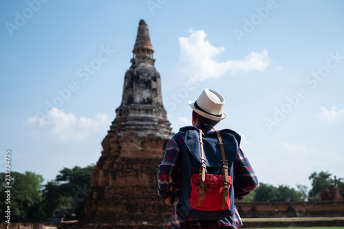Senior man Asian with backpack are walking at Wat Chaiwatthanaram. Ancient and historical attractions and one of the most important archaeology of Ayutthaya province thailand. Travel, Tourist Concept © xreflex