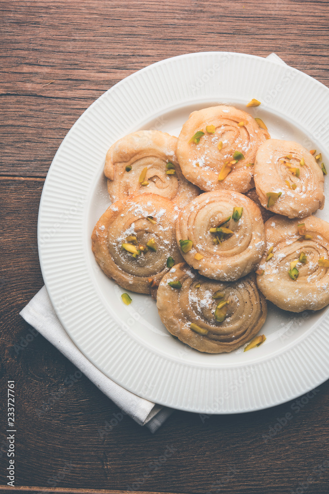 Chirote or Chiroti is a sweet dish from Karnataka and Maharashtra. Served in a plate as a dessert on Festivals or wedding. Selective focus Chirote or Chiroti is a sweet dish from Karnataka and Maharashtra. Served in a plate as a dessert on Festivals or wedding. Selective focus