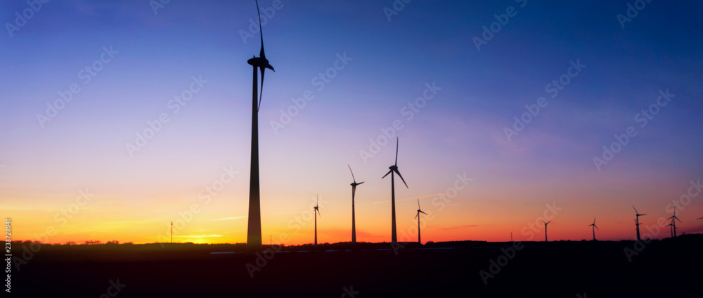 Windmill at Sunset . Wind turbines farm . Windmill at Sunset 